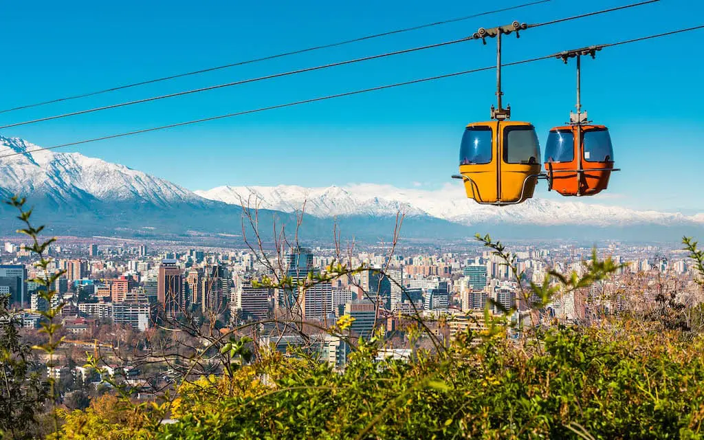 A bird's-eye view of Santiago with the city's gondola in the foreground.