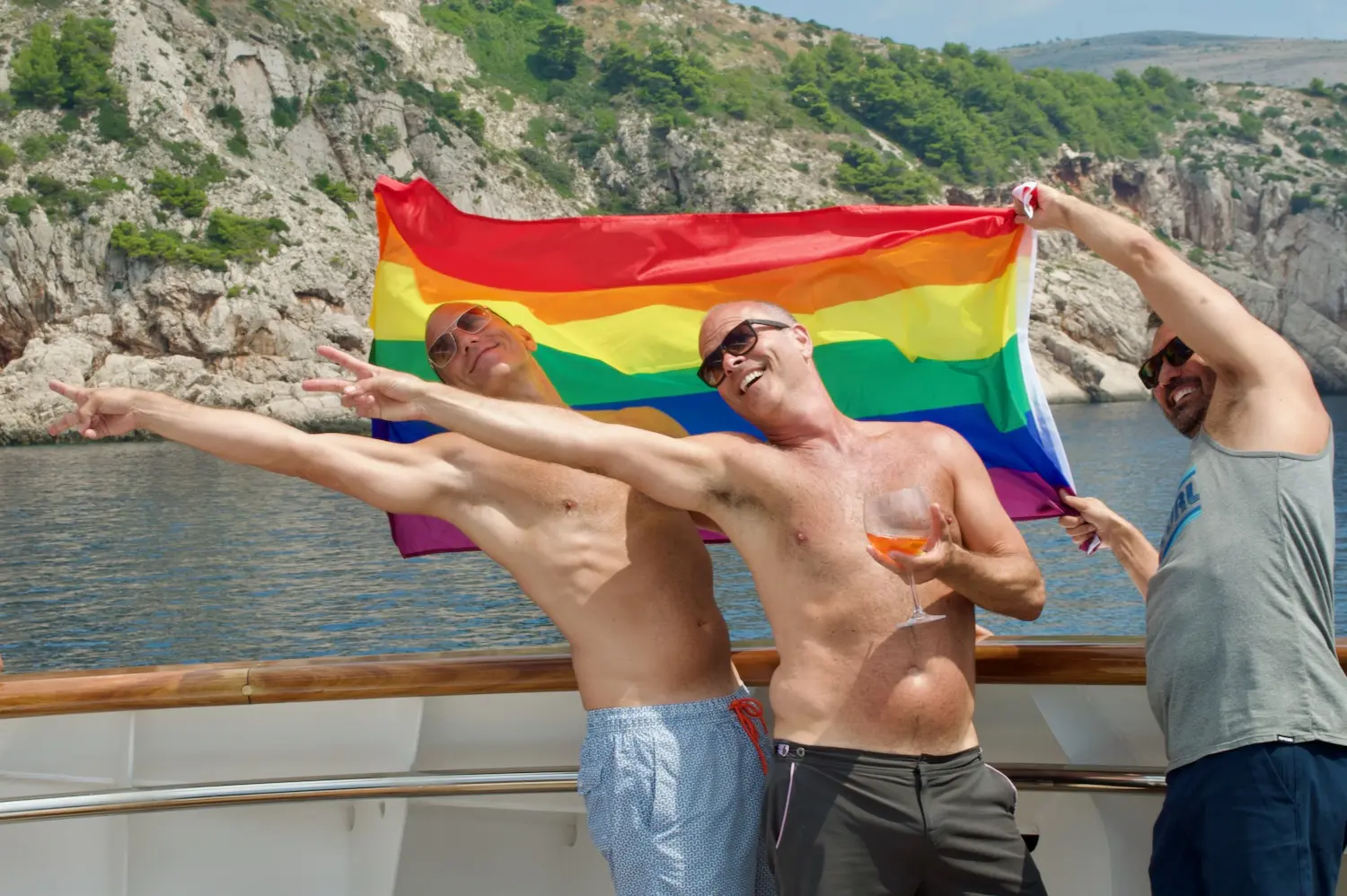 Guests enjoy the wind on our Croatia gay cruise.