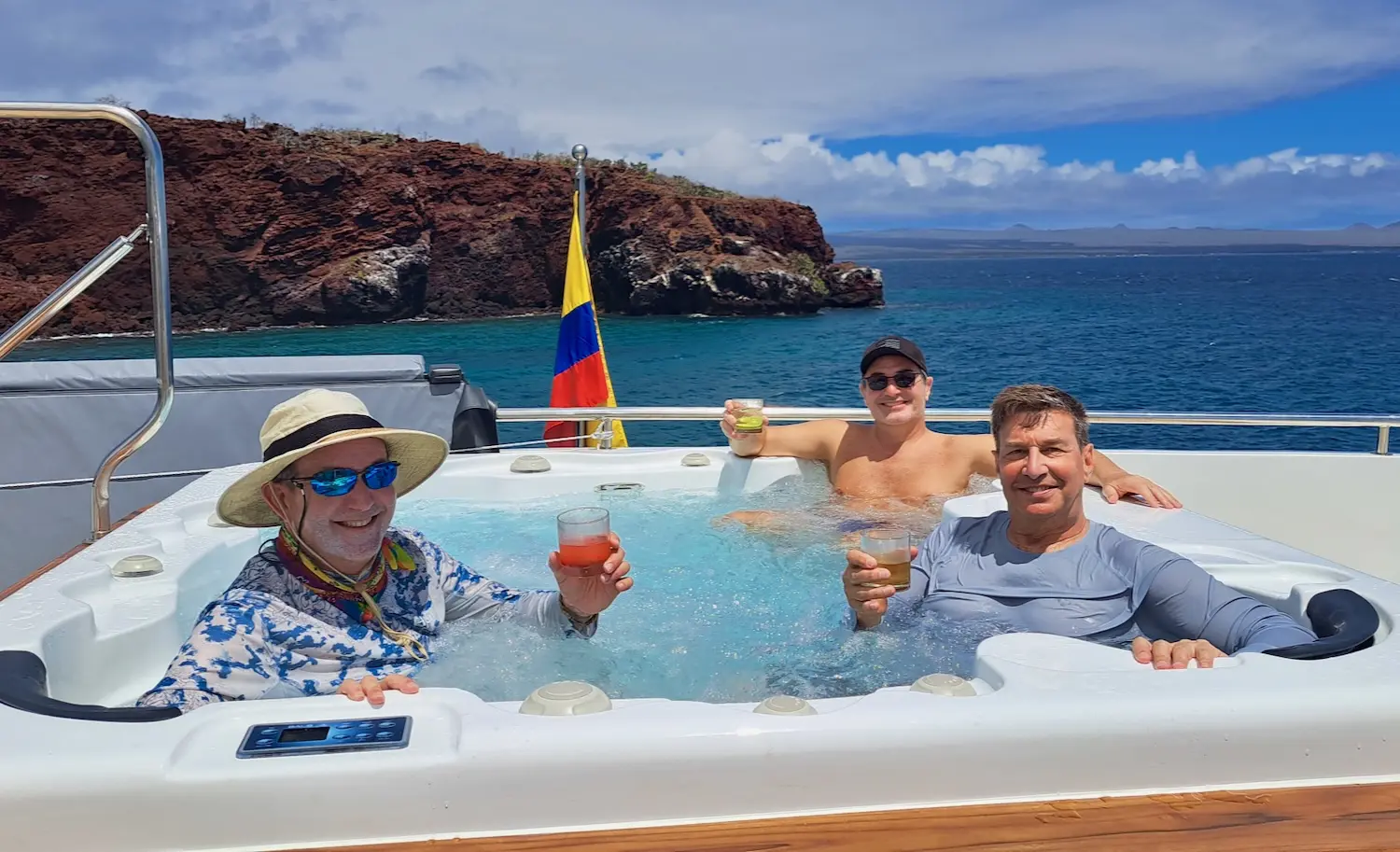 3 guys enjoy the hot tub on our Galapagos gay cruise.