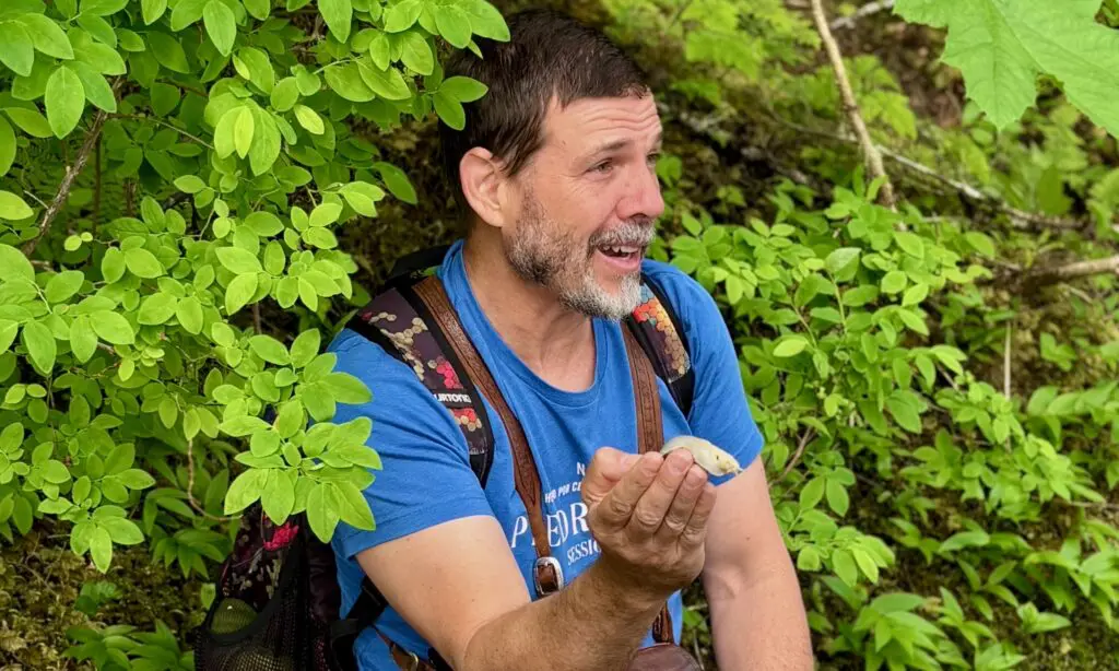 The naturalist talking about a giant slug on a nature hike.