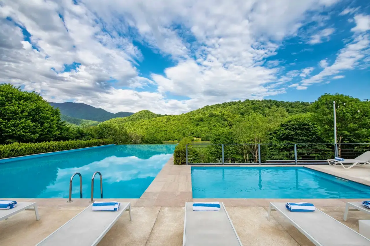 Multiple pools at the Kvareli Lake Resort, one of our Georgia gay-welcoming hotels.