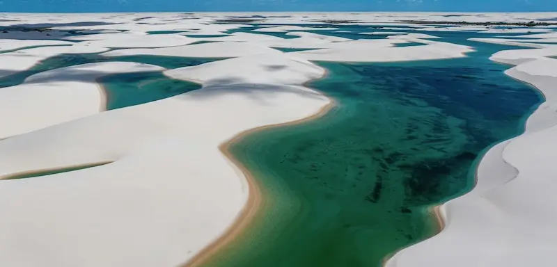 The blue lagoons of Lençóis Maranhenses, a super rare gay group destination.