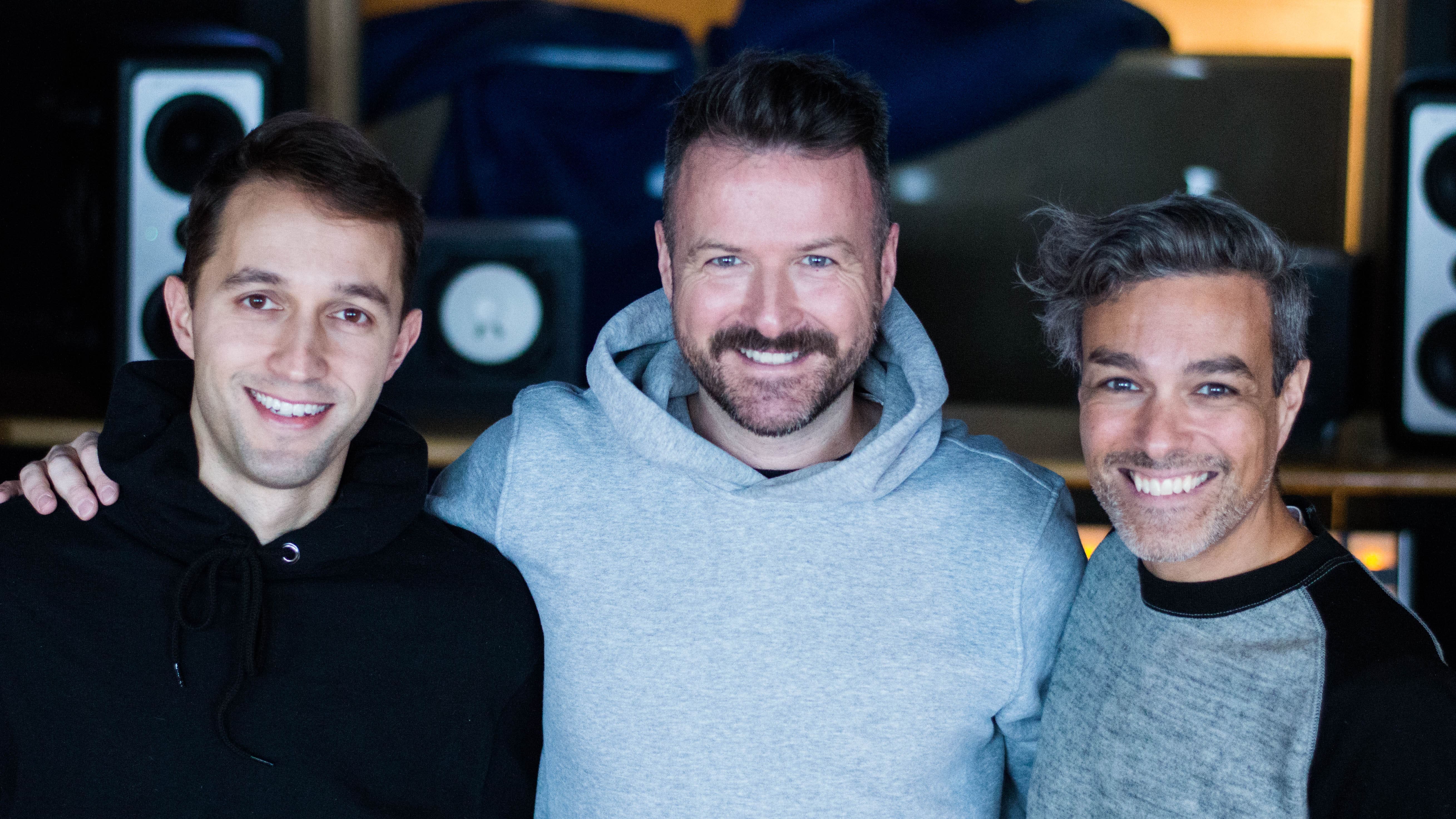 Rui Amaral, Peter Graham and Daniel Faria posing at The Gay Travel Podcast recording studio.