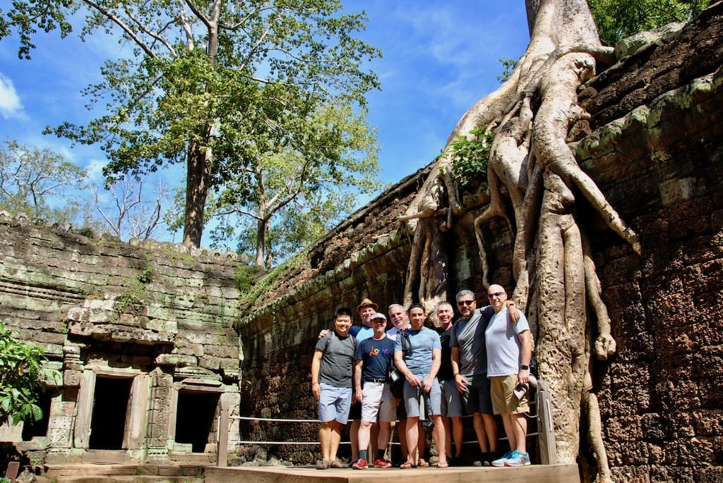 Out Adventures' gay travellers at Ta Prohm in Angkor Archeological Park.