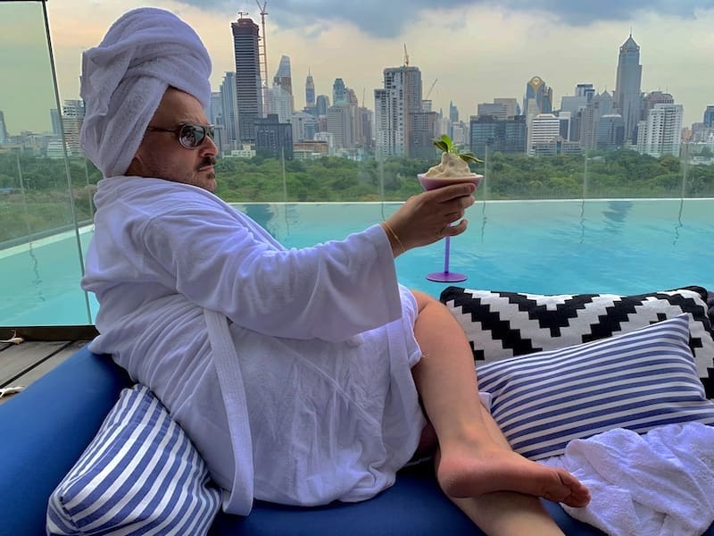 Gay travel writer, Lino DiNallo, poses by the rooftop pool of the So Sofitel in Bangkok, Thailand.