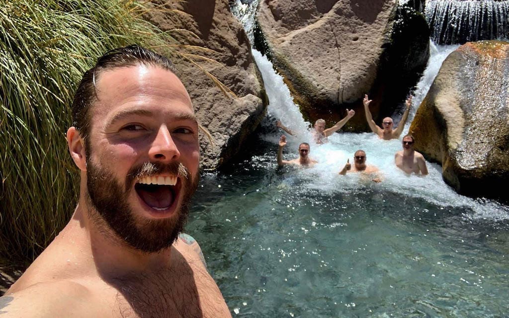 Robert Sharp takes a selfie on Out Adventures gay Chile tour above a natural hot spring.