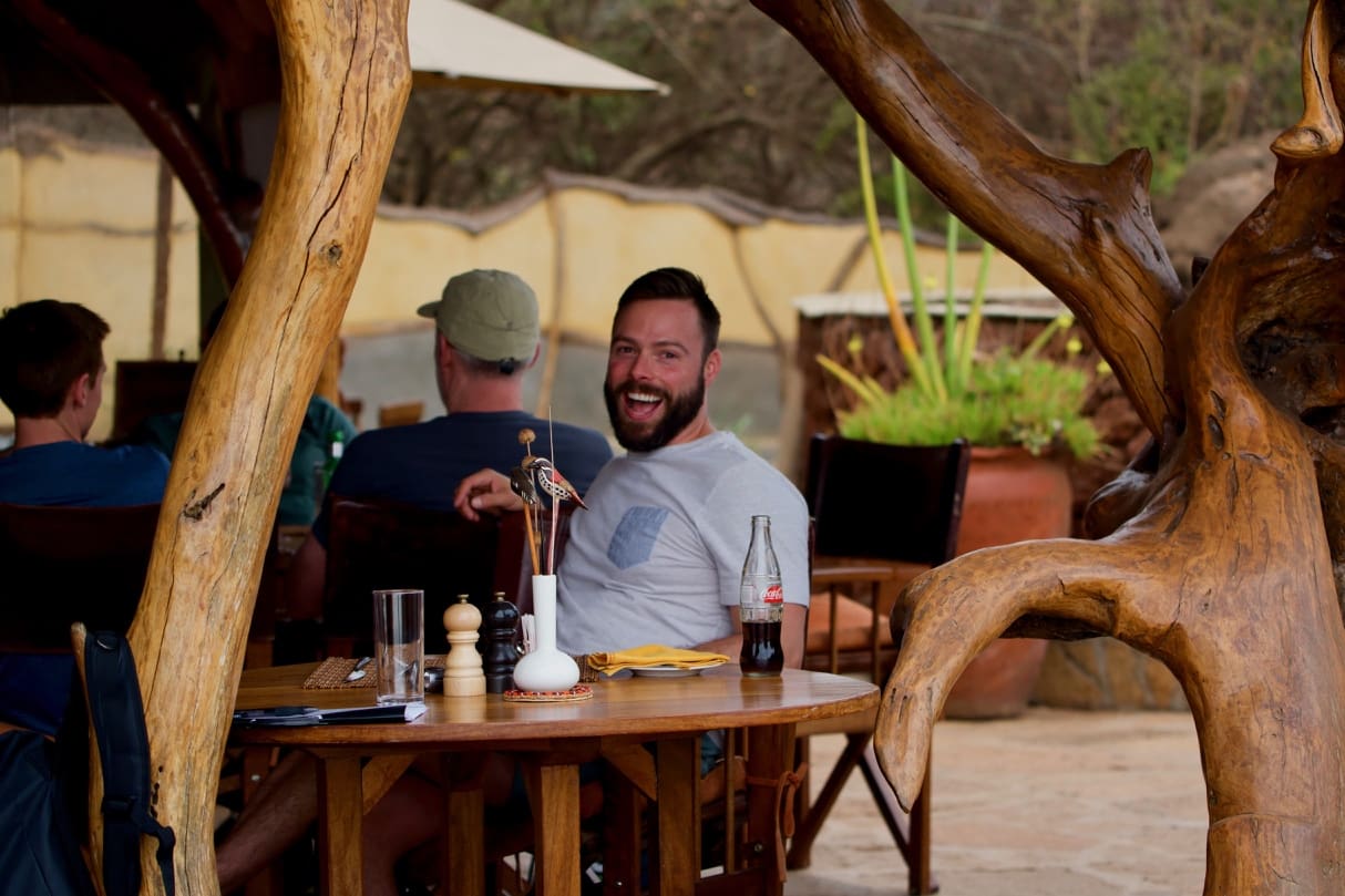 Robert Sharp, owner of Out Adventures, enjoys lunch on the company's gay Kenya safari.