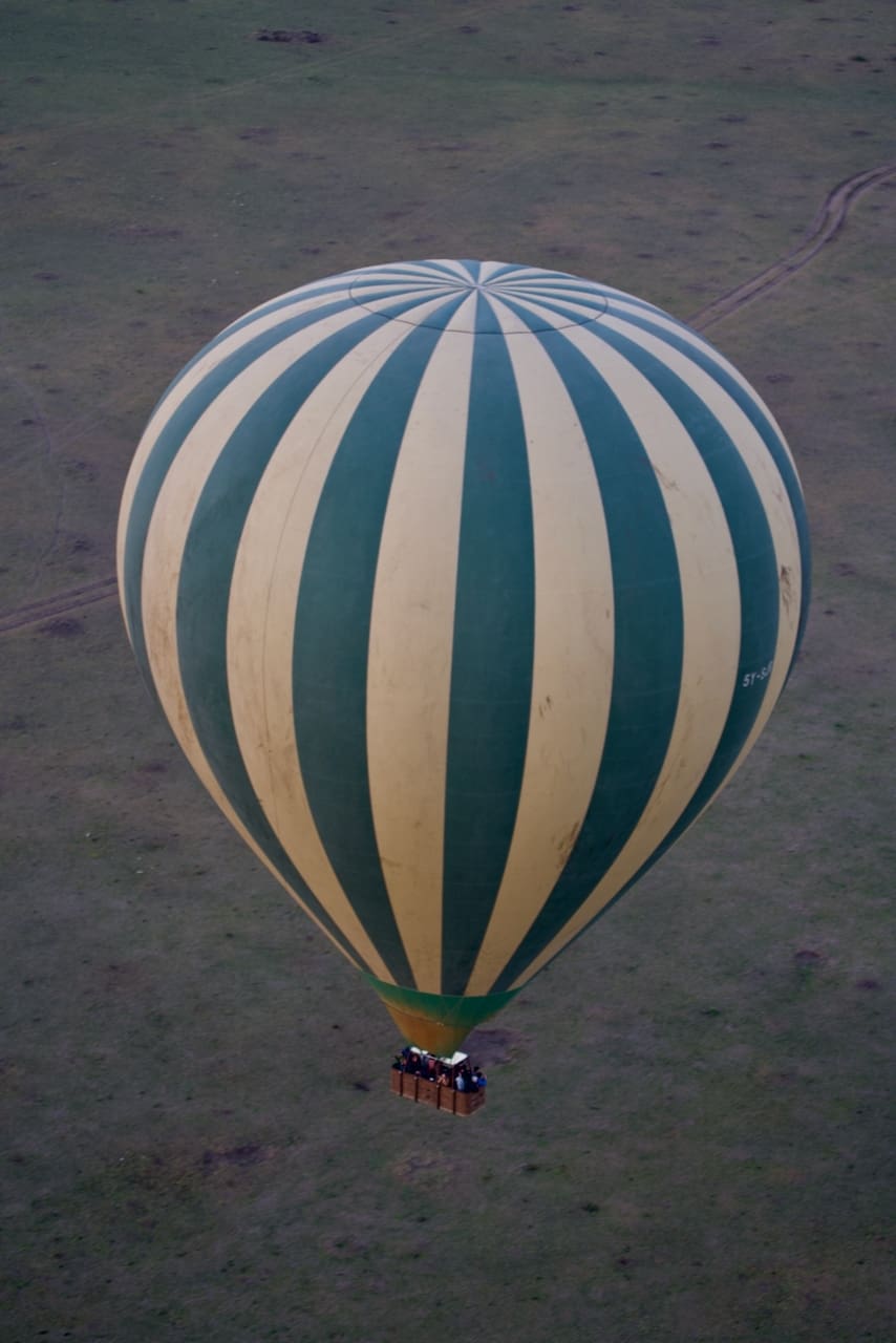 A hot air balloon photographed over Kenyan savannah.