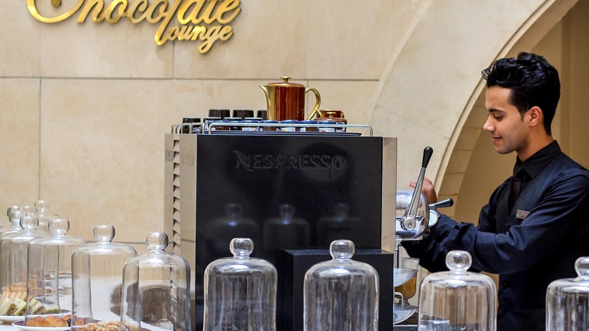 A barista making espresso at The Chocolate Lounge in the Kempinski Hotel in Cairo.
