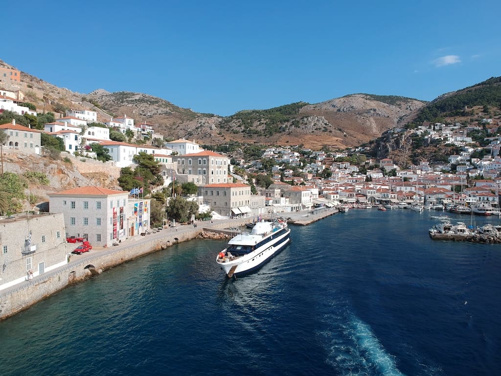 The Harmony G docked outside a small Italian port town.