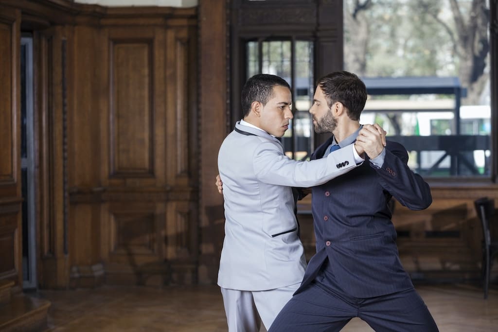 Two gay tango instructors dance together in Buenos Aires, Argentina.