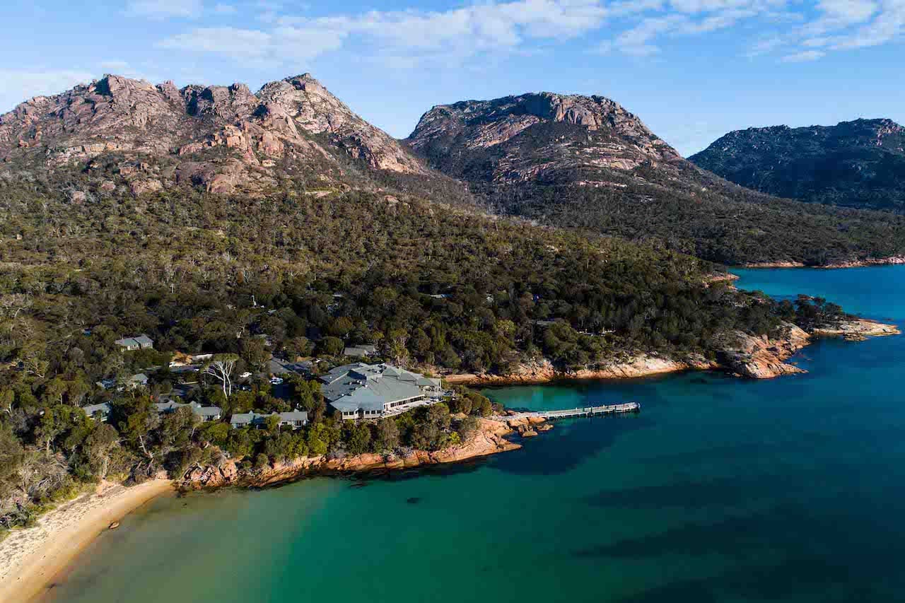 A bird's-eye view of Freycinet Lodge and its surrounding bush and coast.