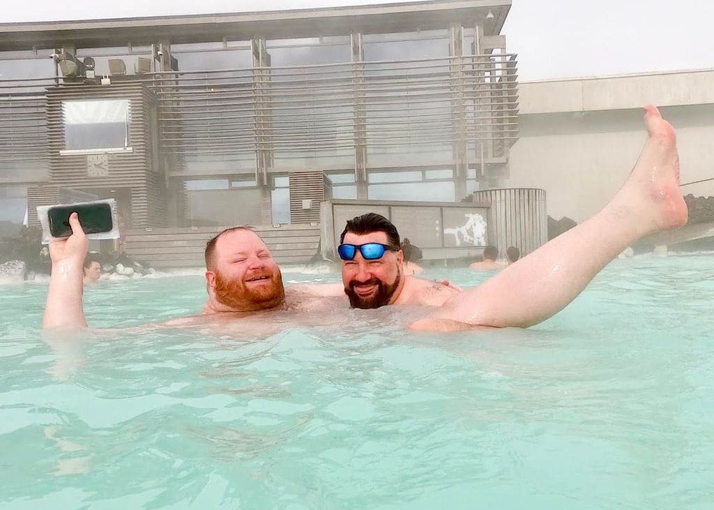 2 bears in Iceland's blue lagoon, a perfect gay winter destination.