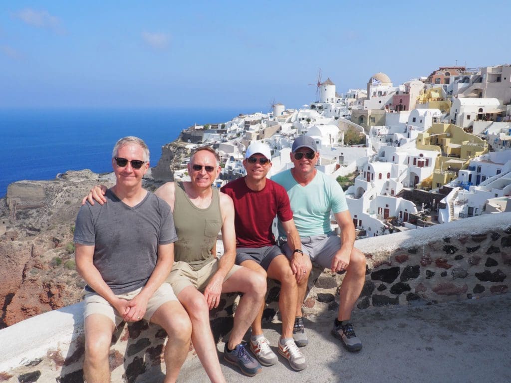 Four gay travellers in Santorini, Greece.